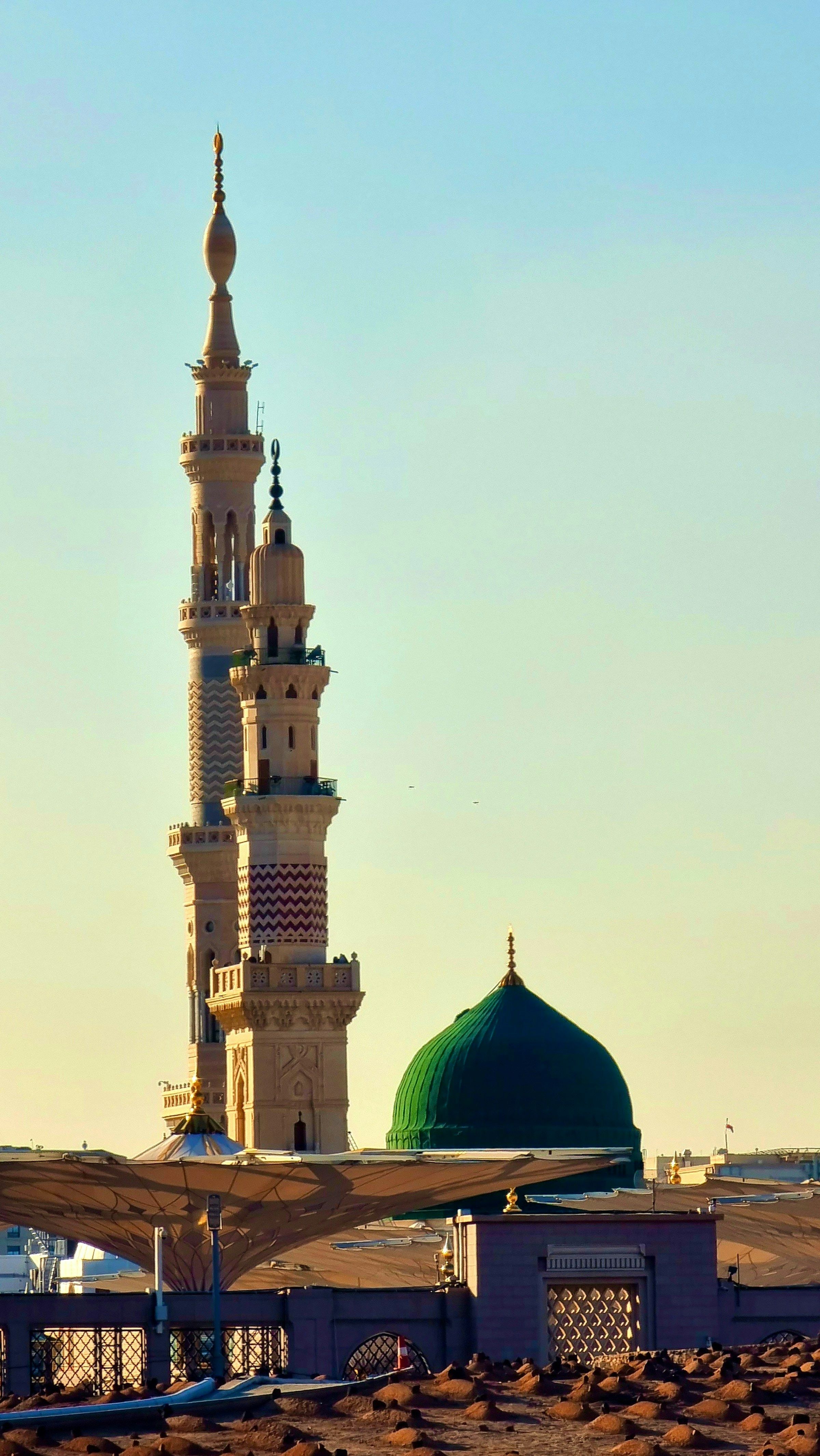 The Green Dome and minarets of Al-Masjid an-Nabawi above the courtyard canopies